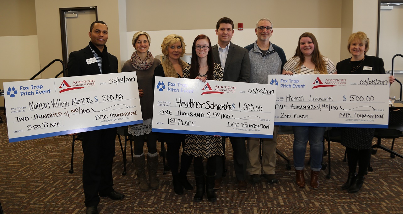 Fox Pitch winners display their prizes with event judges. 